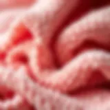 A close-up view of coral washcloth texture showcasing its softness and absorbency.