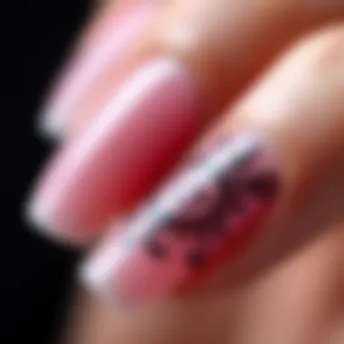 Close-up of a well-manicured nail featuring an intricate design using polish strips.