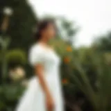 Elegant square neck puff sleeve wedding dress on a model in a garden setting