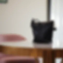 An elegant wrist pouch bag displayed on a stylish table