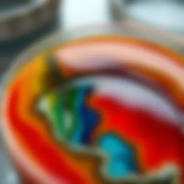 Close-up of a circle epoxy mold filled with colorful resin ready to set.