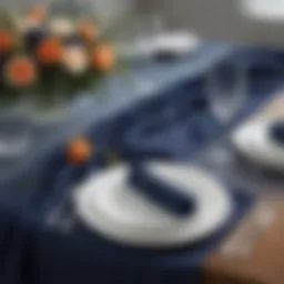 Elegant navy blue gauze table runner draped on a dining table with floral centerpiece