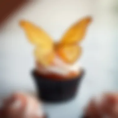 Elegant gold butterfly atop a cupcake