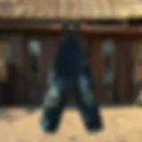 A pair of distressed overalls displayed against a rustic backdrop