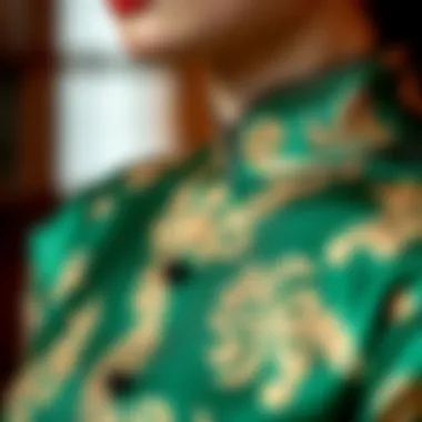 Close-up of intricate fabric patterns of a green cheongsam