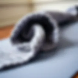 A close-up view of a textured non-slip yoga towel on a yoga mat