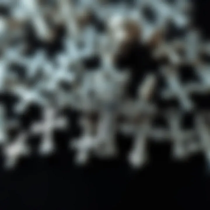 A close-up of various silver cross nail charms highlighting their unique styles.